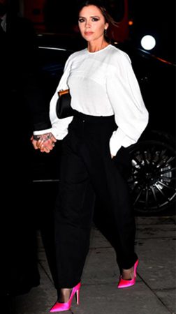 Celebrity Victoria Beckham wearing stiletto heels in Pink color